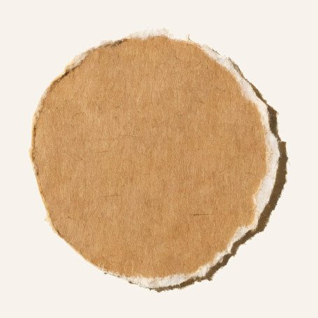 A plain torn-paper wooden disc, undecorated