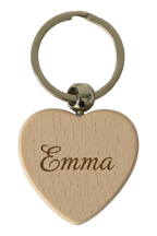 Example of the engraving: the beech wood keyring, heart, laser-engraved with a name in a flowing script