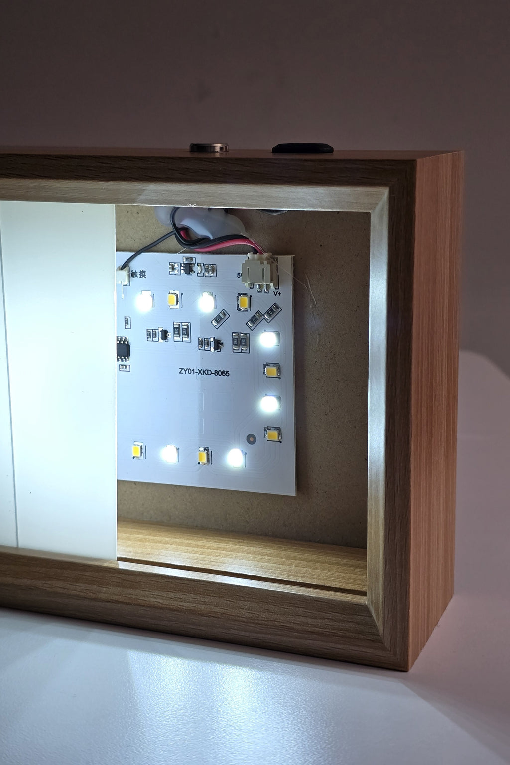 The 6 inch night light in cool white with the panel slid aside