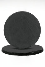 Two round natural slate coasters, 10 cm across, one leaning on the other to show the rough split edge