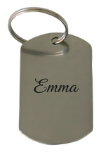 Example of the engraving: the stainless steel keyring, dog tag, laser-marked with a name in a flowing script, dark against the polished steel