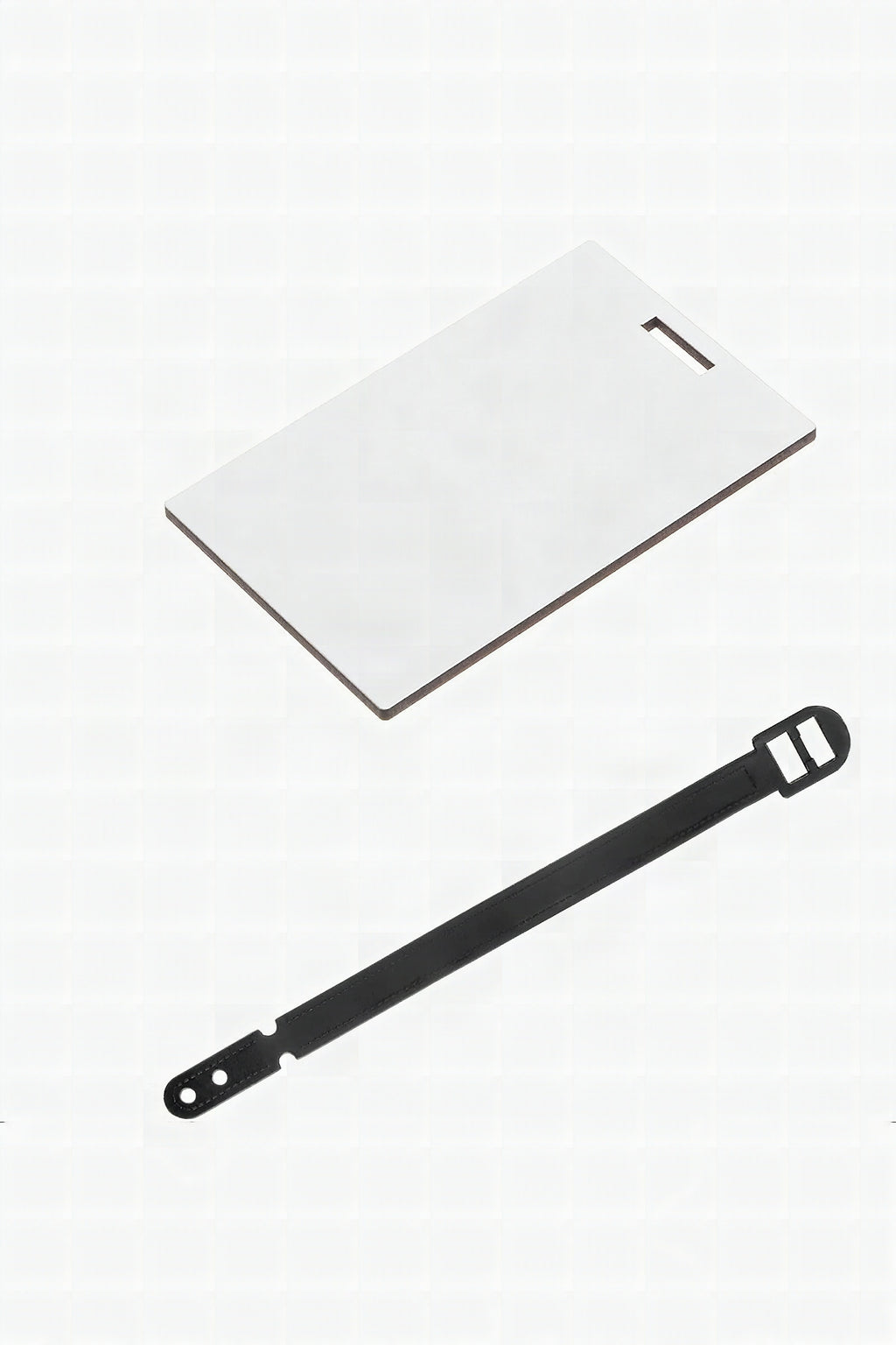 A blank white sublimation bag tag with its black strap beside it