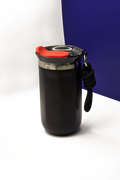 350ml matte black travel coffee cup, lid on, with the black carry rope clipped to its steel collar