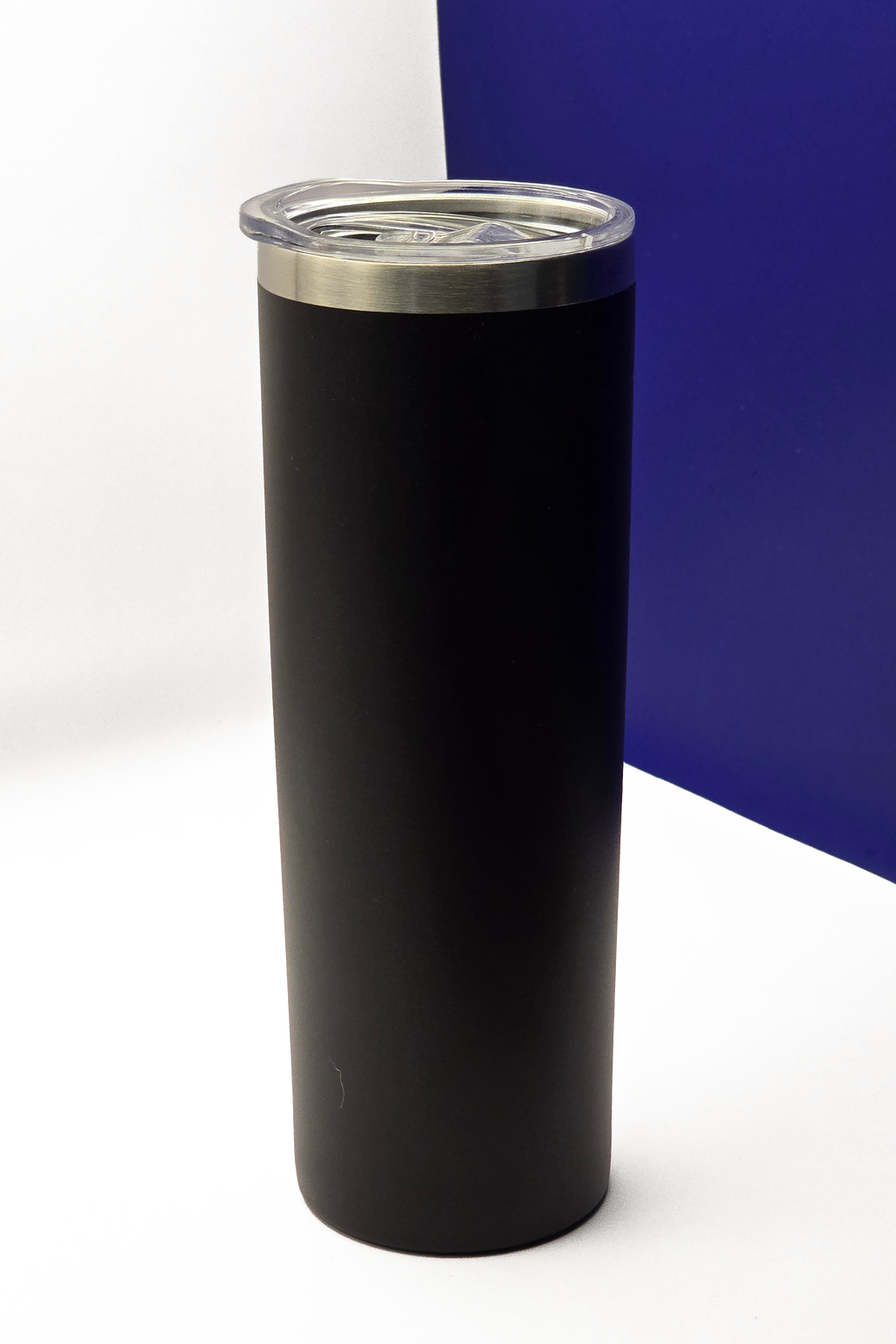 Tall skinny matte black travel cup with the clear lid fitted