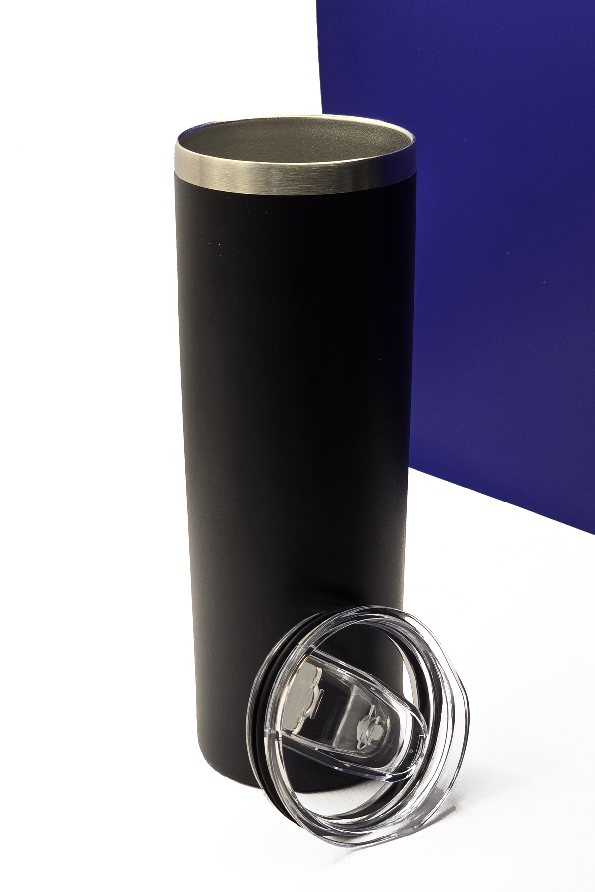The same travel cup with the lid off beside it, showing the stainless steel rim and inner wall