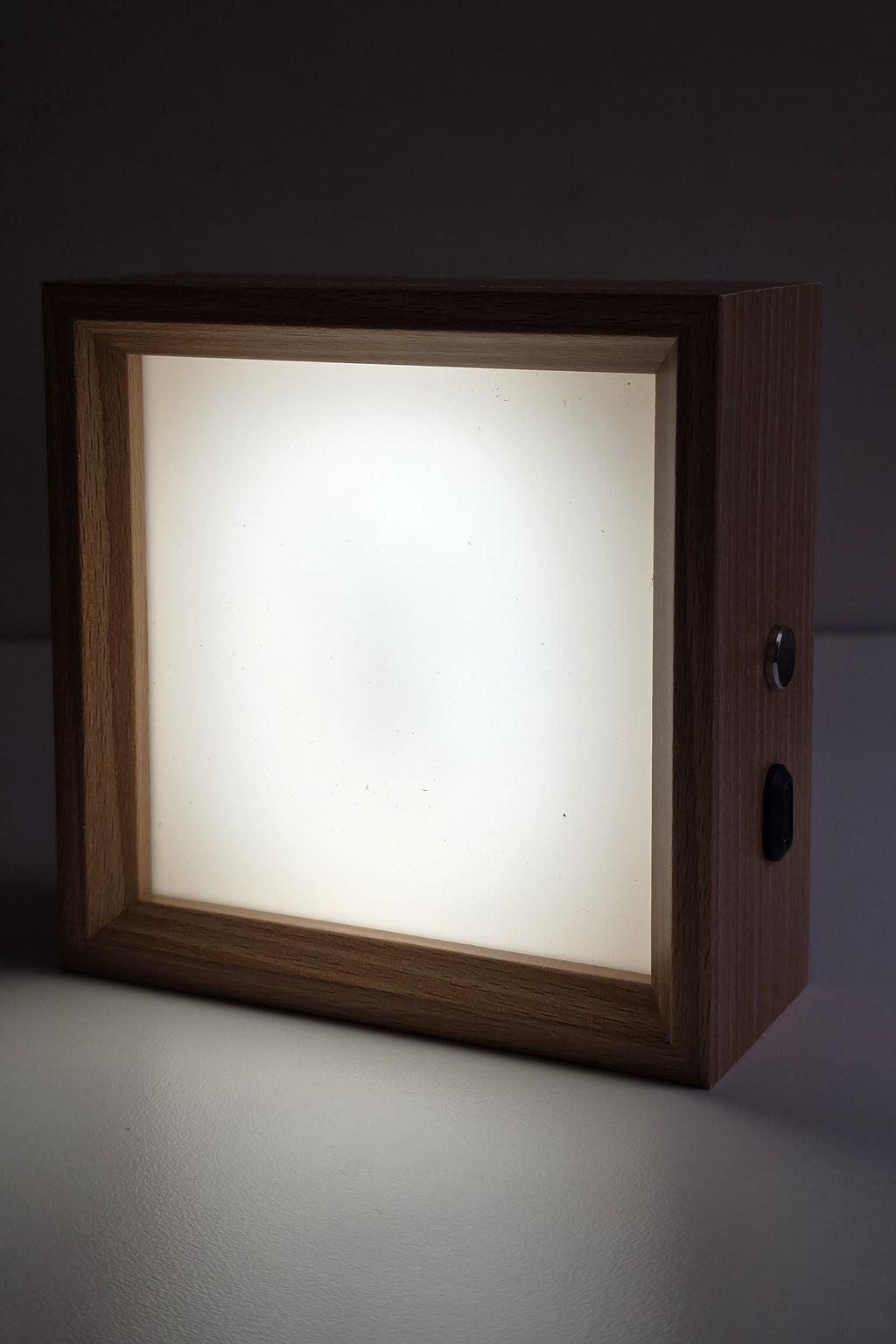 Square wooden photo night light lit in neutral white