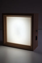 Square wooden photo night light lit in neutral white