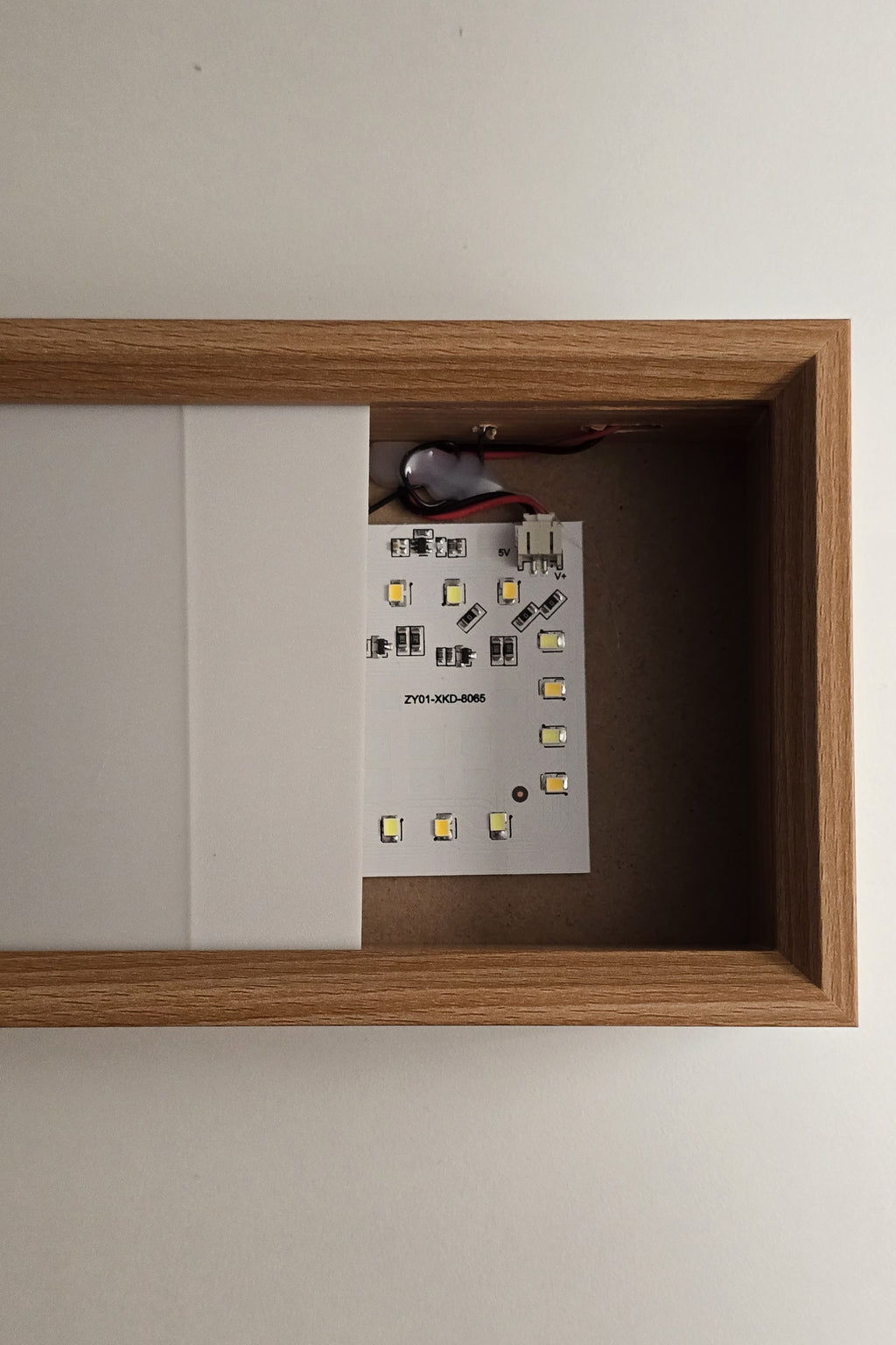 Inside the 6 inch frame, switched off: the LED board and the slot the panel slides into